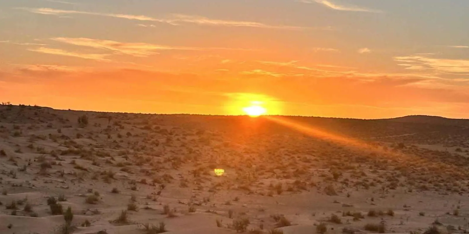 Sunrise over the scrub desert of southern Tunisia