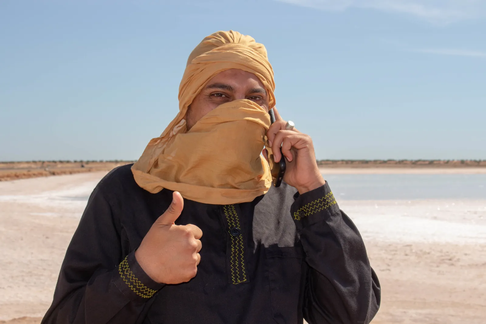 A guide in a shesh headwrap on the Chahbania salt flat