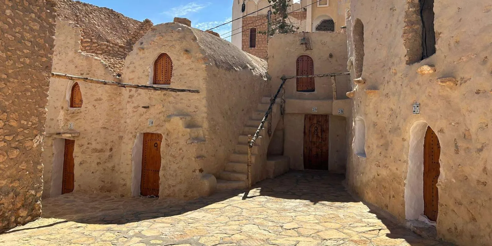 A lane of arched Berber doorways in a southern Tunisian village