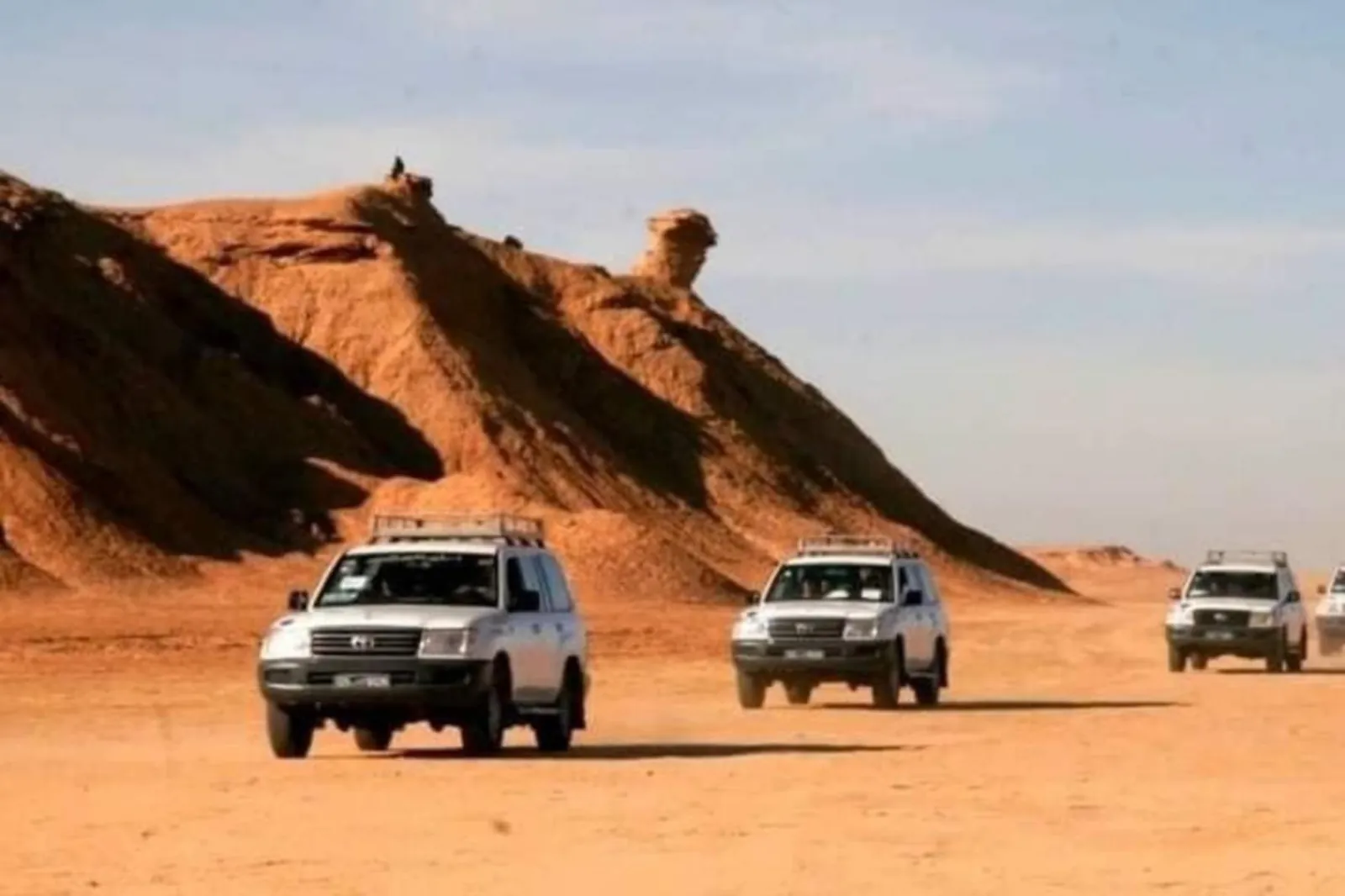 A convoy of 4x4s on the desert track south of the Dahar plateau